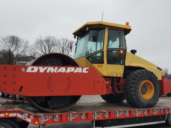 Side view of Dynapac CA702 loaded