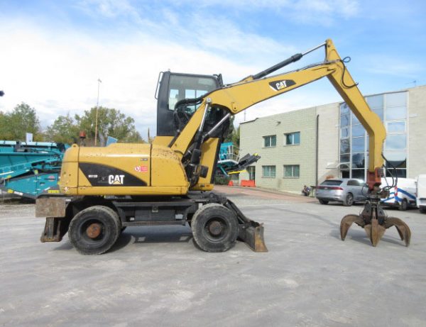 Caterpillar M313D 자재 처리기