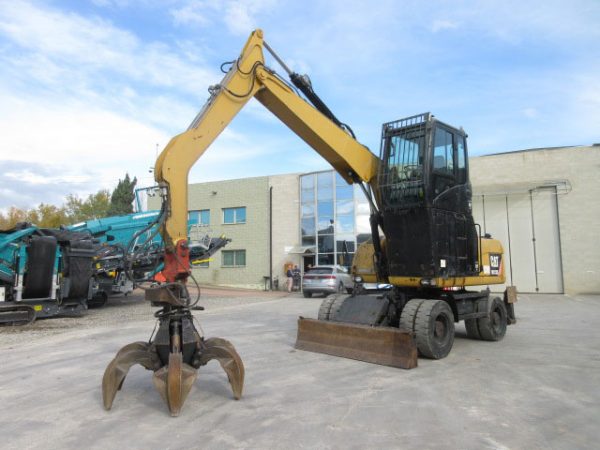 Caterpillar M313D Material Handler