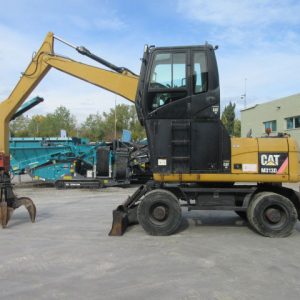 Caterpillar M313D Material Handler